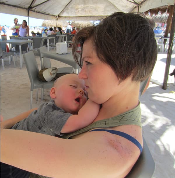 Baby sleeping on a beach