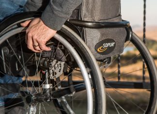 The Complete Guide to Cruising With a Disability Man sitting in a wheelchair