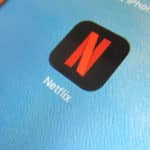 Answered: Can I Watch Streaming (Netflix, Disney+, Etc.) on a Cruise? Netflix logo on iPad