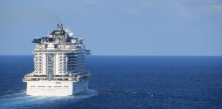 Cruise Prices Are at Their Lowest Level in Years (Here’s How Long You Have to Work to Afford One) Ship sailing away