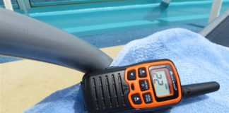 Answered: Do Walkie-Talkies Work on a Cruise Ship? Walkie-talkie laying on lounger