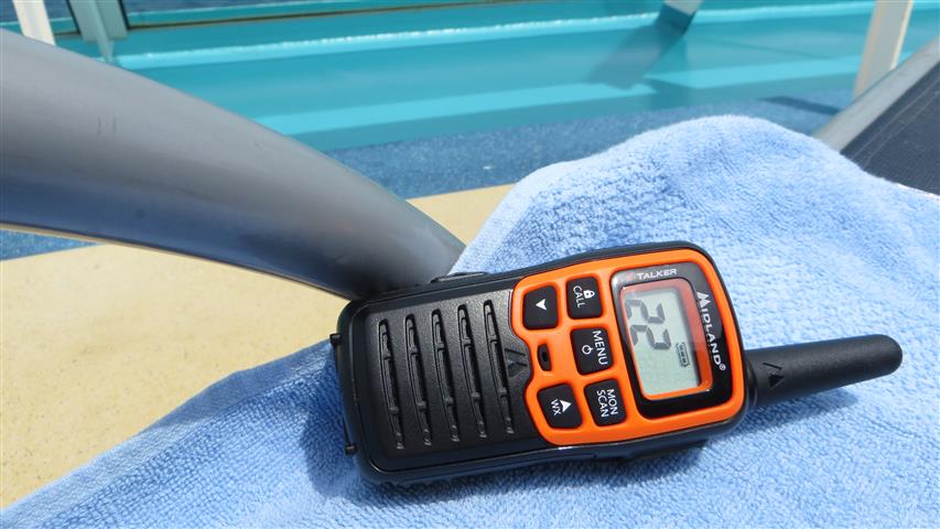Walkie-talkie laying on lounger