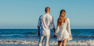 Top Tips for Selecting the Perfect Honeymoon Cruise Married couple on the beach