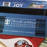 Everything About Cruise Ship Gratuities for 2026 (Amounts, Etiquette, and More) Ship keycard on top of cash money