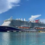 Complete Guide to Sailing Carnival Cruise Line (What It’s Like) Carnival Celebration docked in Roatan, Honduras