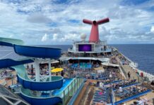Carnival Quietly Makes a Drink Package Change That Means Longer Wait Between Servings Carnival Conquest pool deck with a blue sky