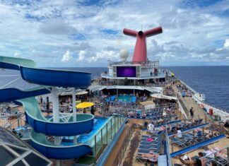 Carnival Quietly Makes a Drink Package Change That Means Longer Wait Between Servings Carnival Conquest pool deck with a blue sky
