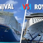 Carnival vs. Royal Caribbean: 11 Major Differences Between the Cruise Lines Carnival and Royal Caribbean ship next to each other.