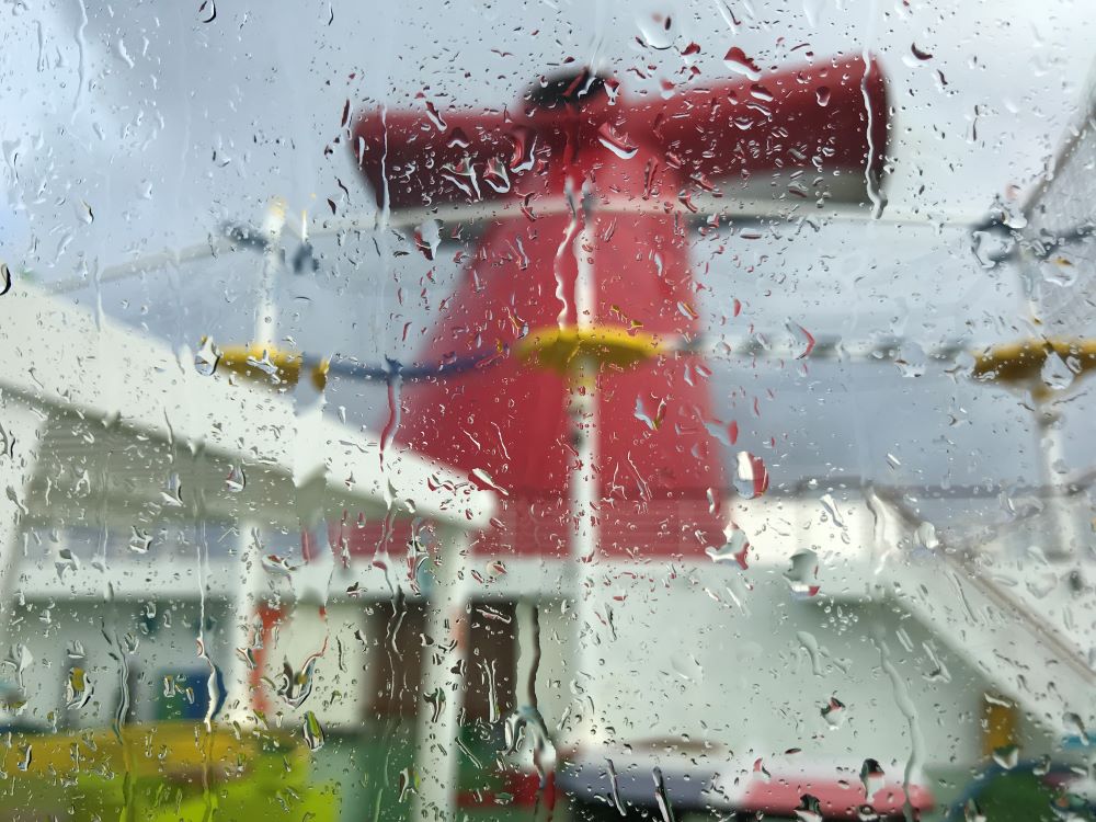 Rain on a window with Carnival funnel