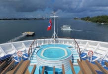 Why It’s Risky to Cruise Without Insurance (3 Big Reasons) Clouds on horizon of cruise ship