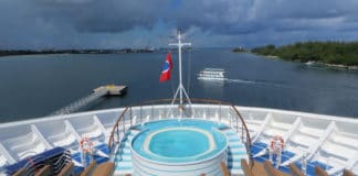 Why It’s Risky to Cruise Without Insurance (3 Big Reasons) Clouds on horizon of cruise ship