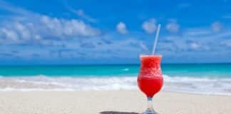 Signs You Should (Or Shouldn’t) Buy a Cruise Drink Package Cocktail on a beach