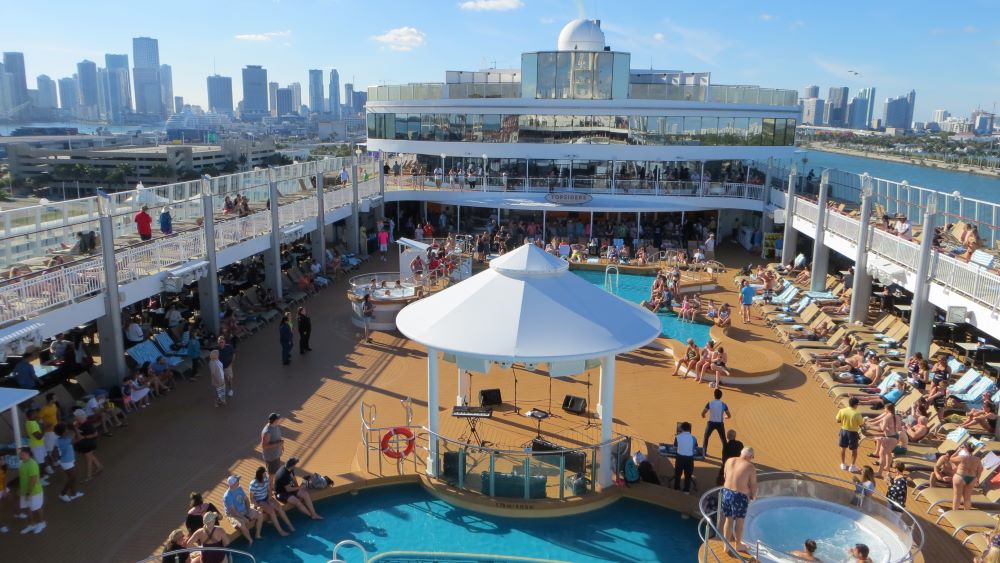 A pool deck on a sunny cruise ship