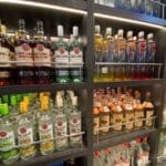 What Happens If I’m Caught Sneaking Alcohol on a Cruise? Am I Kicked Off? Bottles of alcohol in a duty-free store