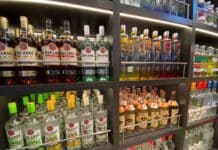 What Happens If I’m Caught Sneaking Alcohol on a Cruise? Am I Kicked Off? Bottles of alcohol in a duty-free store