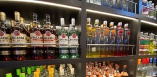 What Happens If I’m Caught Sneaking Alcohol on a Cruise? Am I Kicked Off? Bottles of alcohol in a duty-free store