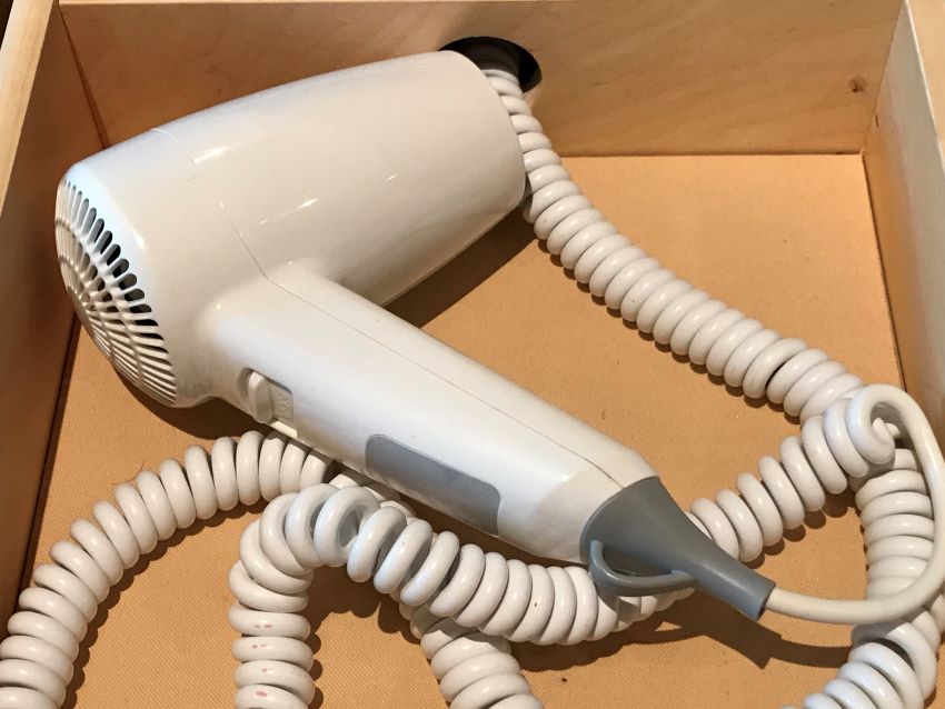 Hair dryer in a cruise cabin