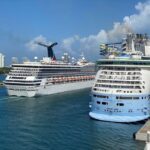 The Best Cruise Lines for Kids & Families Carnival ship passing a Royal Caribbean ship in Miami