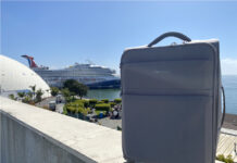 39 Useful Things to Pack For Your Cruise (Including 17 You’d Never Think Of) What to pack for a cruise feature image showing a suitcase and cruise ship