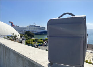What to pack for a cruise feature image showing a suitcase and cruise ship