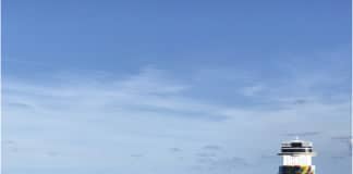 Cruise Lines Suspend Sailings Until at Least September 15 Cruise ship sitting in the ocean far away