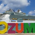62 Can’t-Miss Things For Cruise Passengers to Do in Cozumel Cruise ship docked in front of sign in Cozumel