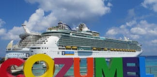 62 Can’t-Miss Things For Cruise Passengers to Do in Cozumel Cruise ship docked in front of sign in Cozumel