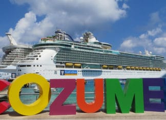 62 Can’t-Miss Things For Cruise Passengers to Do in Cozumel Cruise ship docked in front of sign in Cozumel