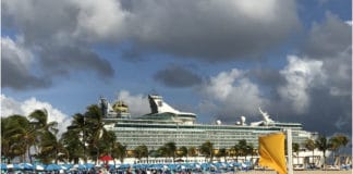 Is Now the Best Time to Book a Cruise? Cruise ship docked at island