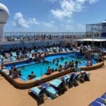 Elbow Room: List of Cruise Ships Ranked By Space Per Passenger (Find Your Ship) Cruise passengers on a busy pool deck
