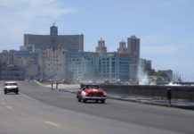 Trump Administration Bans Cruises to Cuba. Here’s What to Do… Car driving down malecon in Cuba