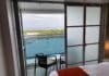 Infinite Balconies on a Cruise: Pros, Cons, and Should You Book? An infinite balcony room with one door closed.