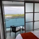 Infinite Balconies on a Cruise: Pros, Cons, and Should You Book? An infinite balcony room with one door closed.