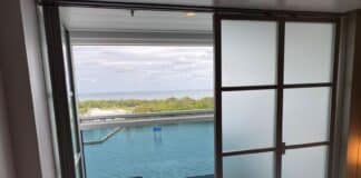 Infinite Balconies on a Cruise: Pros, Cons, and Should You Book? An infinite balcony room with one door closed.