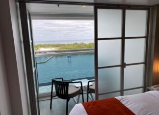 Infinite Balconies on a Cruise: Pros, Cons, and Should You Book? An infinite balcony room with one door closed.