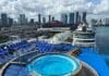 Which Cruise Line Has the Cheapest Cruises from Miami? View of the Miami skyline with cruise ships in the foreground