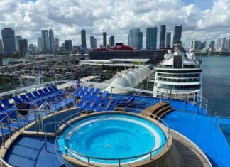 Which Cruise Line Has the Cheapest Cruises from Miami? View of the Miami skyline with cruise ships in the foreground