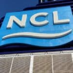 Reviewed: Everything about NCL Cruise Internet (Speed, Discounts, and More) Logo of NCL on a cruise ship