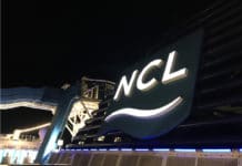 Norwegian Asks CDC to Restart Cruises July 4 With Vaccines Required Norwegian Cruise Lines sign at night