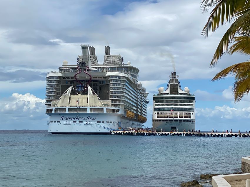 Old cruise ship docked next to a new one