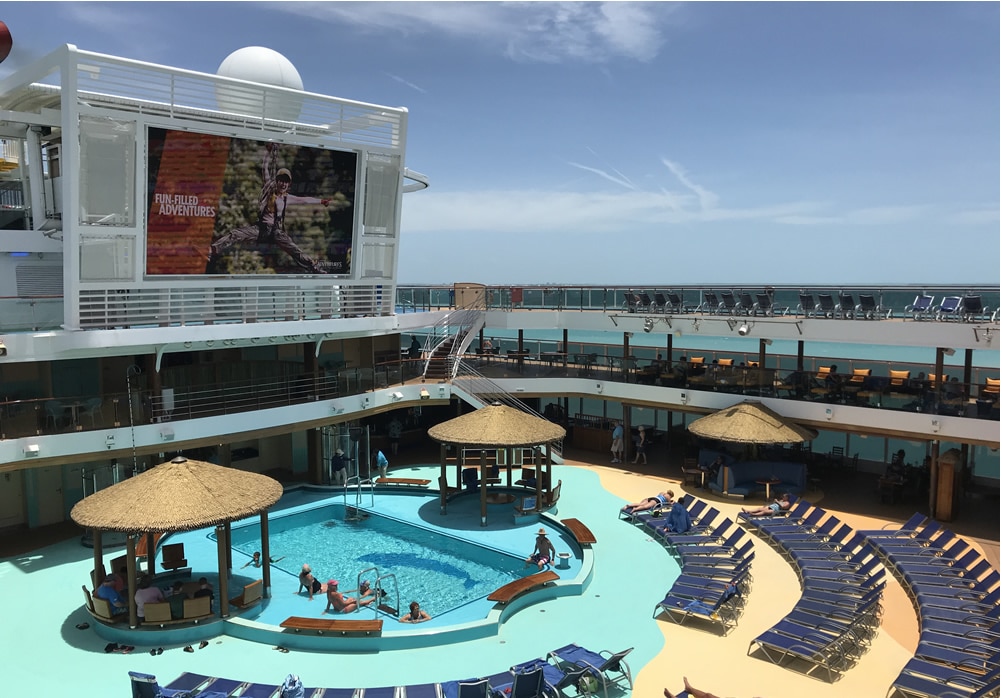 Pool deck with few passengers.