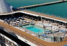 Staying on a Cruise Ship in Port: What to Know Before You Stay An empty pool deck while a ship is docked in port.