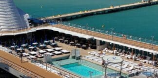 Staying on a Cruise Ship in Port: What to Know Before You Stay An empty pool deck while a ship is docked in port.
