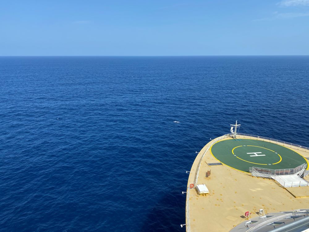 Blue skies at sea from bow of ship