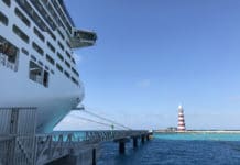15 Must-Know Things About Ports of Call on a Cruise Ship in port of call with lighthouse in the distance