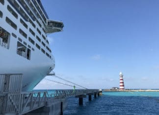 15 Must-Know Things About Ports of Call on a Cruise Ship in port of call with lighthouse in the distance
