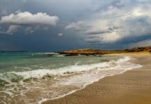 Explained: Cancel For Any Reason Cruise Travel Insurance Stormy beach