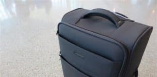 11 Must-Have Things to Pack in Your Cruise Carry On Suitcase in an airport