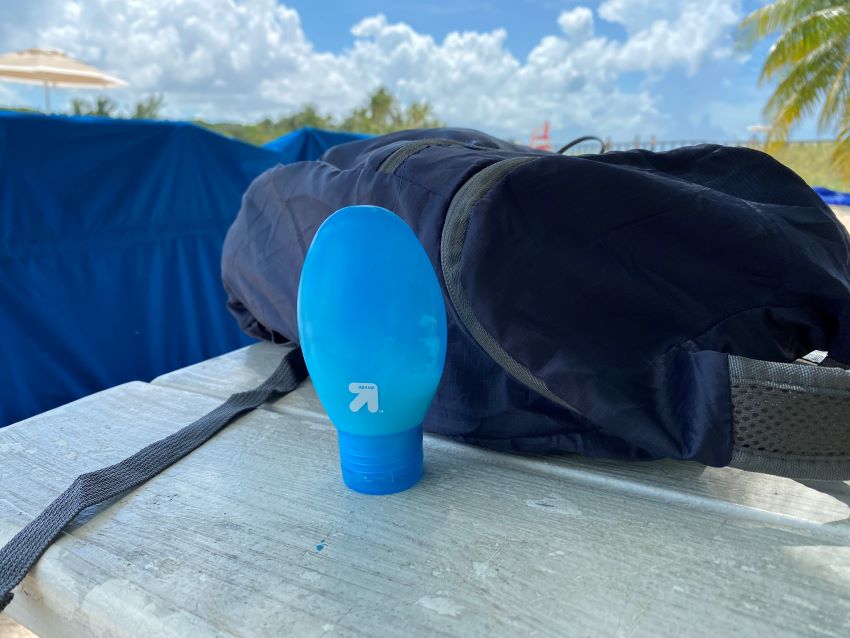 Bottle of sunscreen sitting on a table
