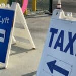 5 Easy Ways to Get to the Los Angeles and Long Beach Cruise Ports Taxi and Lyft sign at Los Angeles airport
